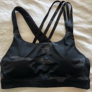 Athleta sports bra in black camo, very gently worn, looks new size medium.